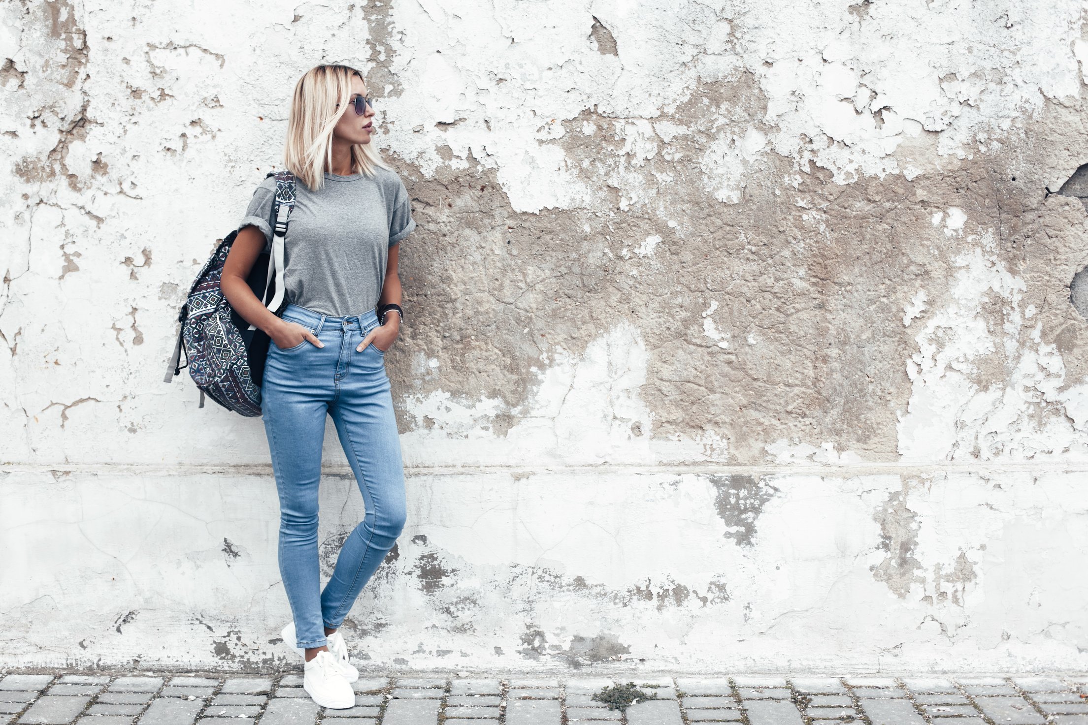 Model Posing in Plain Tshirt against Street Wall